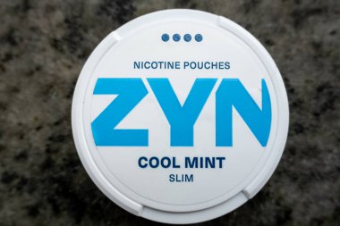 Stockholm, Sweden Oct 26, 2024 plastic box containing Zyn smokeless nicotine patches. clipart