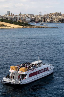 Valletta, Malta Nov 5, 2024 A commuter ferry boat in the harbor. clipart