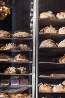 Uppsala, Sweden Nov 22, 2024 The window of the landmark Guntherska  bakery and loaves of bread on trays. clipart