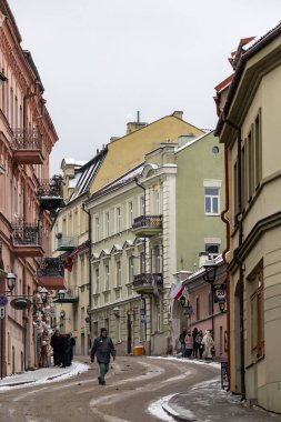 Vilnius, Lithuania Jan 5, 2025 A man crosses the street  in the Uzupis bohemian district. clipart