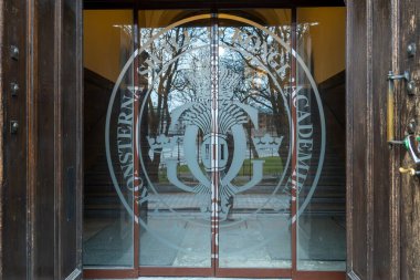 Stockholm, Sweden Jan 31, 2025 A glass door and sign at the entrance to the Konstakademie, or Academy of Fine Arts, building and gallery space. clipart