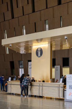 Cairo, Egypt Jan 28, 2025 A man and a woman visit the information counter at the Grand Egyptian Museum in the Giza district. clipart