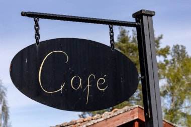 Vinon, İsveç Kafe yazan eski bir tabela