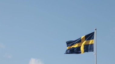 Stockholm, İsveç Bayrak direğinde dalgalanan İsveç bayrağı. 