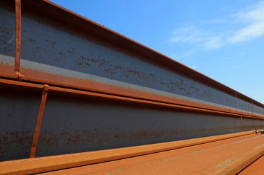 steel plate banding piled up together, closeup of photo
