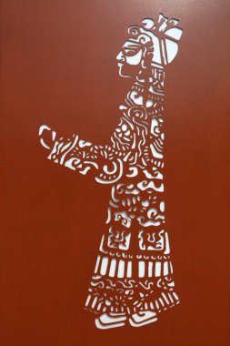 Çelik plakalara oyulmuş çizgi film figürleri.