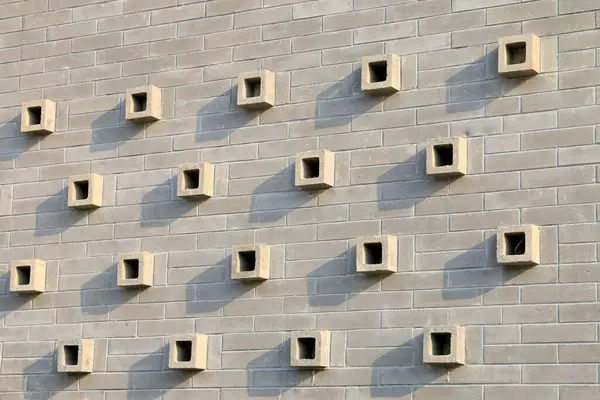 Gri duvar süslemesi, fotoğrafın yakın çekimi.