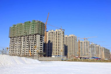 Unfinished buildings, closeup of photo