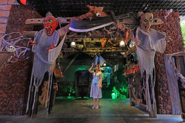 Sanya City, China - March 31, 2019: A girl stands at the entrance of the ghost scenic spot, Sanya City, Hainan Province, China