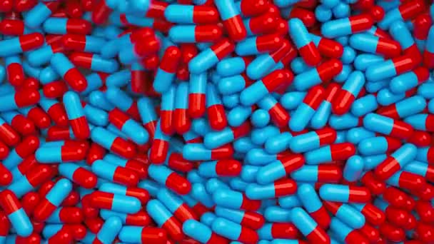 Κόκκινα Και Μπλε Χάπια Ανάμιξη Και Περιστροφή Αργή Κίνηση Φάρμακα — Αρχείο Βίντεο