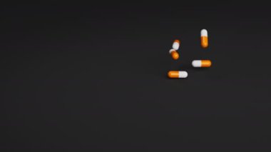 Beyaz ve turuncu haplar ağır çekimde siyah arka plana düşüyor. İlaçlar, haplar, haplar, ilaç konsepti. 3d canlandırma canlandırması.