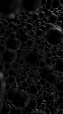 Siyah yansıtıcı kürelerin arasından uç. Süzülen toplar ve sığ dof ile soyut koyu renk 3d render geometrik arkaplan. Döngülü animasyon. Dikey video.