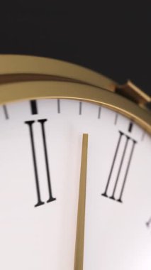 Closeup of golden watch minute arrow, camera follows as it move all the way around a clock. 3d render vertical video.