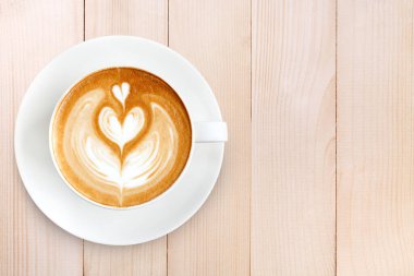 Üstten Görünüm latte sanat ahşap arka plan üzerinde kahve