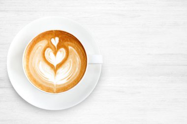 Üstten Görünüm latte sanat ahşap arka plan üzerinde kahve