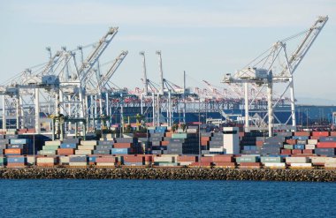 California, U.S.A - November 5, 2022 - The view of the cranes and shipments on Long Beach Container Terminal on a sunny day clipart