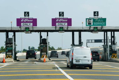 Ocean City, New Jersey, U.S - June 18, 2023 - The E-ZPass and full service toll booth by the exit into town clipart