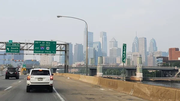 stock image Philadelphia, Pennsylvania, U.S.A - June 29, 2023 - Traffic on I-95 North with the foggy view of the city due to the smoke of Canadian forest fire