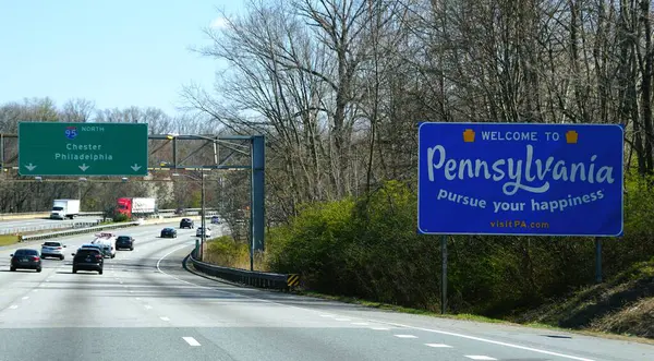 stock image Wilmington, Delaware, U.S.A - April 7, 2024 - The welcome sign into the state of Pennsylvania on Interstate-95 North