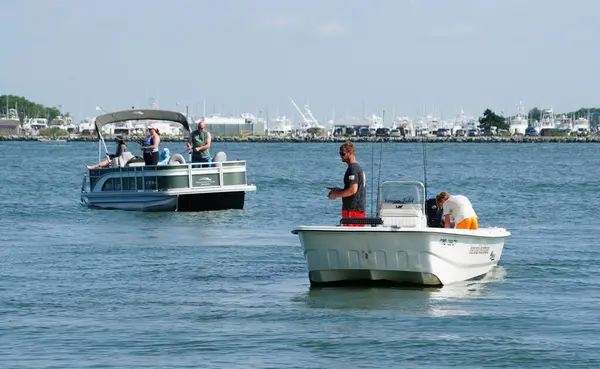 stock image Bethany Beach, Delaware, U.S.A - August 3, 2024 - Anglers on the boat fishing for flounder near Indian River Inlet in the summer