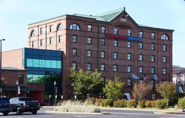 Wilmington, Delaware, U.S.A - September 8, 2024 - The red brick building of Delaware State University in the downtown campus area clipart