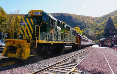 Jim Thorpe, Pennsylvania, U.S.A - October 19, 2024 - The Reading Northern train on the railroad surrounded by the fall foliage clipart