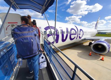 Lakeland, Florida, U.S.A - November 14, 2024 - Passengers boarding the Avelo Airlines at Lakeland Linder International Airport clipart