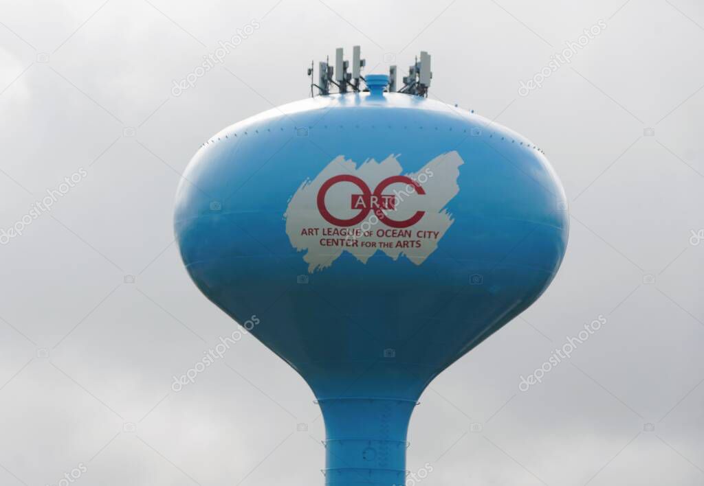 Ocean City, Maryland, U.S.A - May 23, 2025 - The logo of the Art League of Ocean City, prominently displayed on the water tower, is a striking visual.
