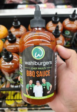 Delaware, U.S.A - Sept 30, 2025 - The 14.5 oz bottle of Wahlburgers Chef Paul's BBQ Sauce in a retail setting.