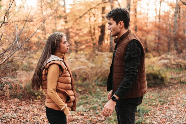 Young couple fighting outdoors, out in the nature, fall vibes