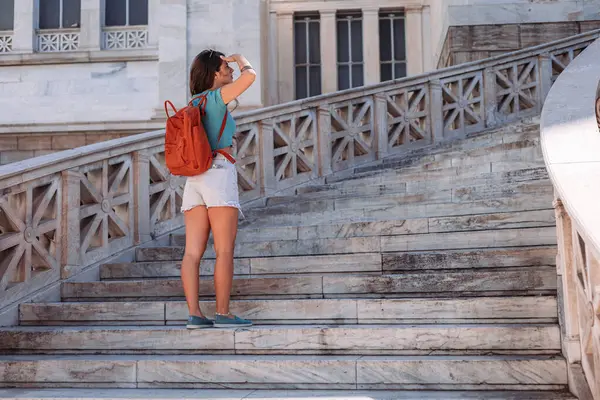 Stock image Young brunette female tourist standing on the stars in Athens, Greece