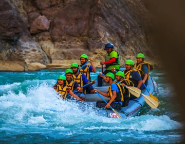 Young persons rafting on the river Ganges in Rishikesh India, extreme and fun sport at tourist attraction