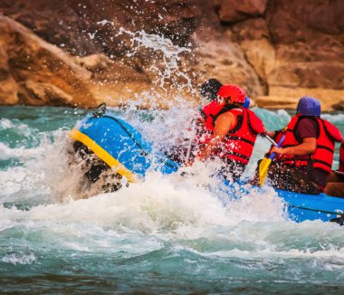 Young persons rafting on the river Ganges in Rishikesh India, extreme and fun sport at tourist attraction