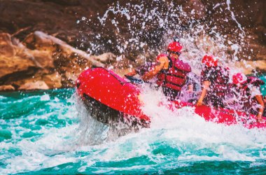 Young persons rafting on the river Ganges in Rishikesh India, extreme and fun sport at tourist attraction