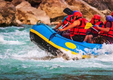 Young persons rafting on the river Ganges in Rishikesh India, extreme and fun sport at tourist attraction