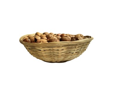 Dried nuts in wicker bowl isolated object top view, soft focus clipping path, pistachio, hazelnuts, walnuts, healthy raw food organic diet concept