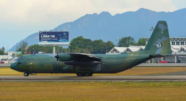 Langkawi, Malaysia - Mar 30, 2019. Lockheed C-130H-30 Hercules M30-10 TUDM of Royal Malaysian Air Force taxiing at Langkawi Airport.