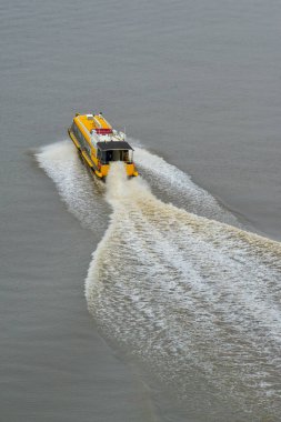 Saigon, Vietnam - Feb 11, 2023. Speed motorboat running on Saigon River. Saigon (Ho Chi Minh City) is the largest and most dynamic financial and economic center in Vietnam.