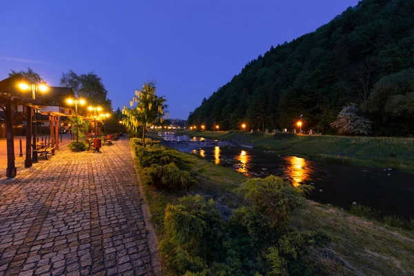 stock image Promenade in Szczawnica over the Grajcarek stream. Night scenery.