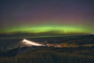 Aurora Borealis over the beach at danish Coast. High quality photo