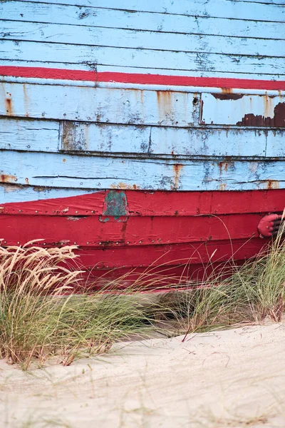 old fishing boat lying on the beach in Denmark. High quality photo