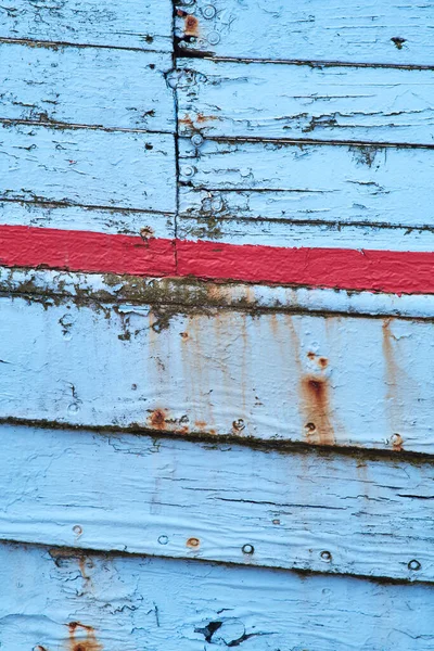 weathered paint on wodden shipping boat. High quality photo