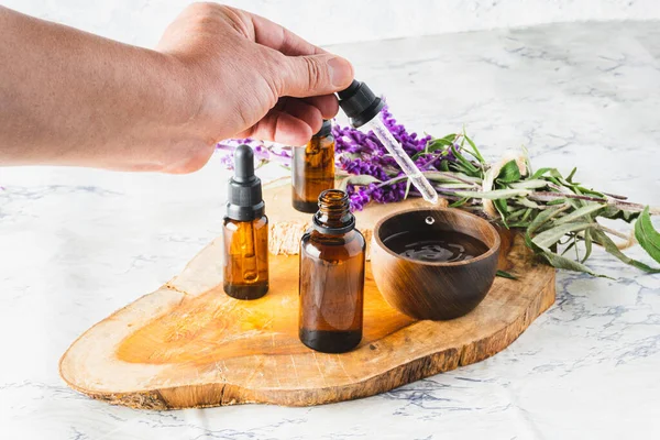 Close Hand Placing Drops Essential Oil Well Dropper Lavender Flowers — Stock Photo, Image