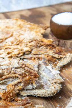 Close-up vertical shot of a salt cod detail