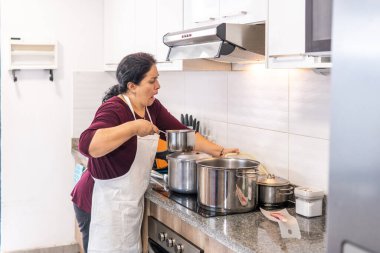 Woman who burns cooking in the kitchen. High quality photo