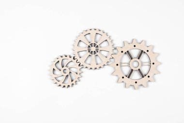 Gears. Gear wheel. Mechanisms are interconnected by themselves. On a white background. The concept of dependence on each other.