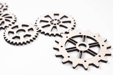 Gears. Gear wheel. Mechanisms are interconnected by themselves. On a white background. The concept of dependence on each other.