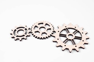 Gears. Gear wheel. Mechanisms are interconnected by themselves. On a white background. The concept of dependence on each other.