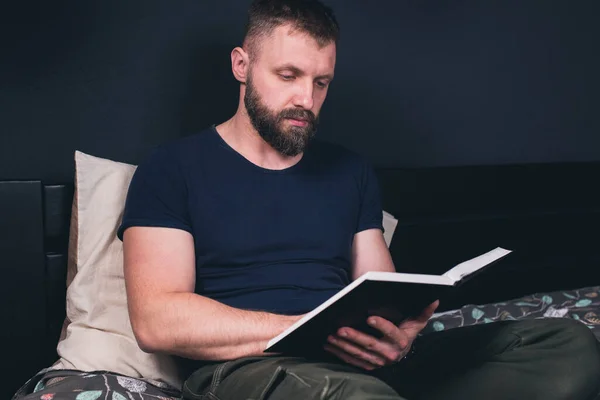 Young Man Sits Bed Reads Bible Book Prayer — Stock Photo, Image