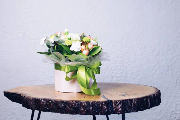 A bouquet of flowers on the table. Vase with Flowers. Wedding bouquet. Spring.